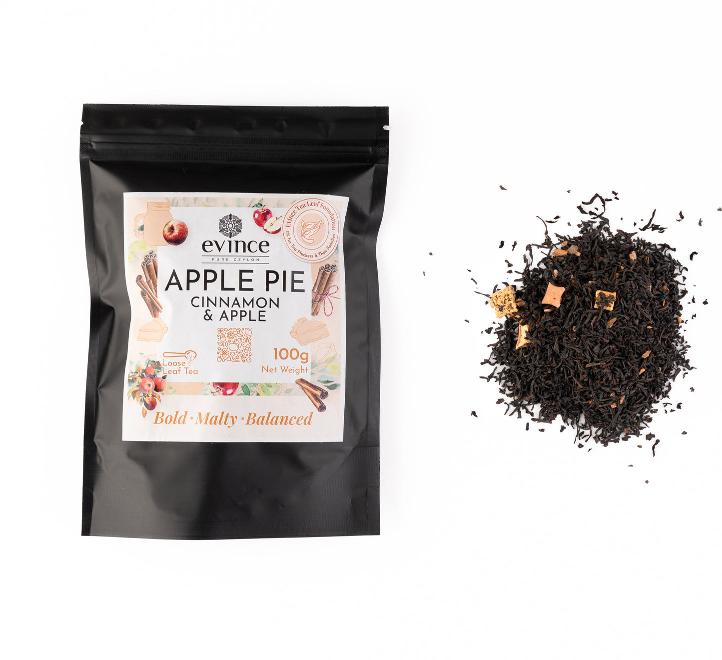 Warm Ceylon black tea with cinnamon and apple pieces and its pack on a white background