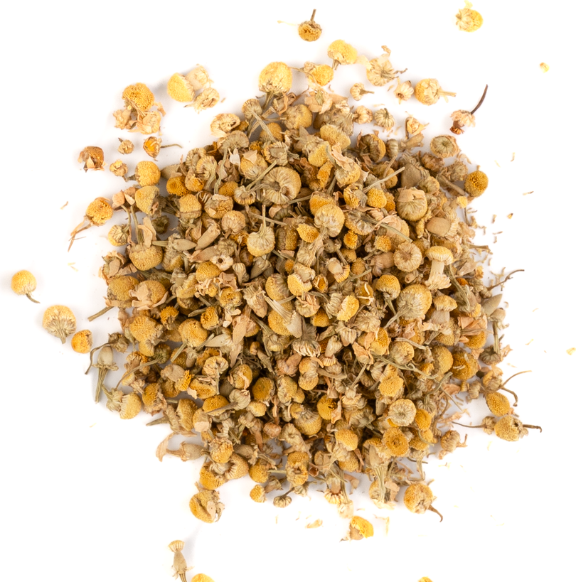 Loose leaf chamomile tea with dried blossoms displayed on a white background