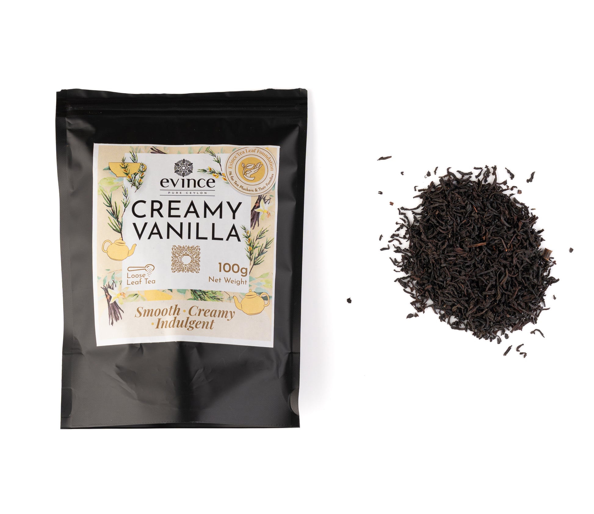 Creamy vanilla tea with loose black tea leaves and vanilla beans with its pack on a white background