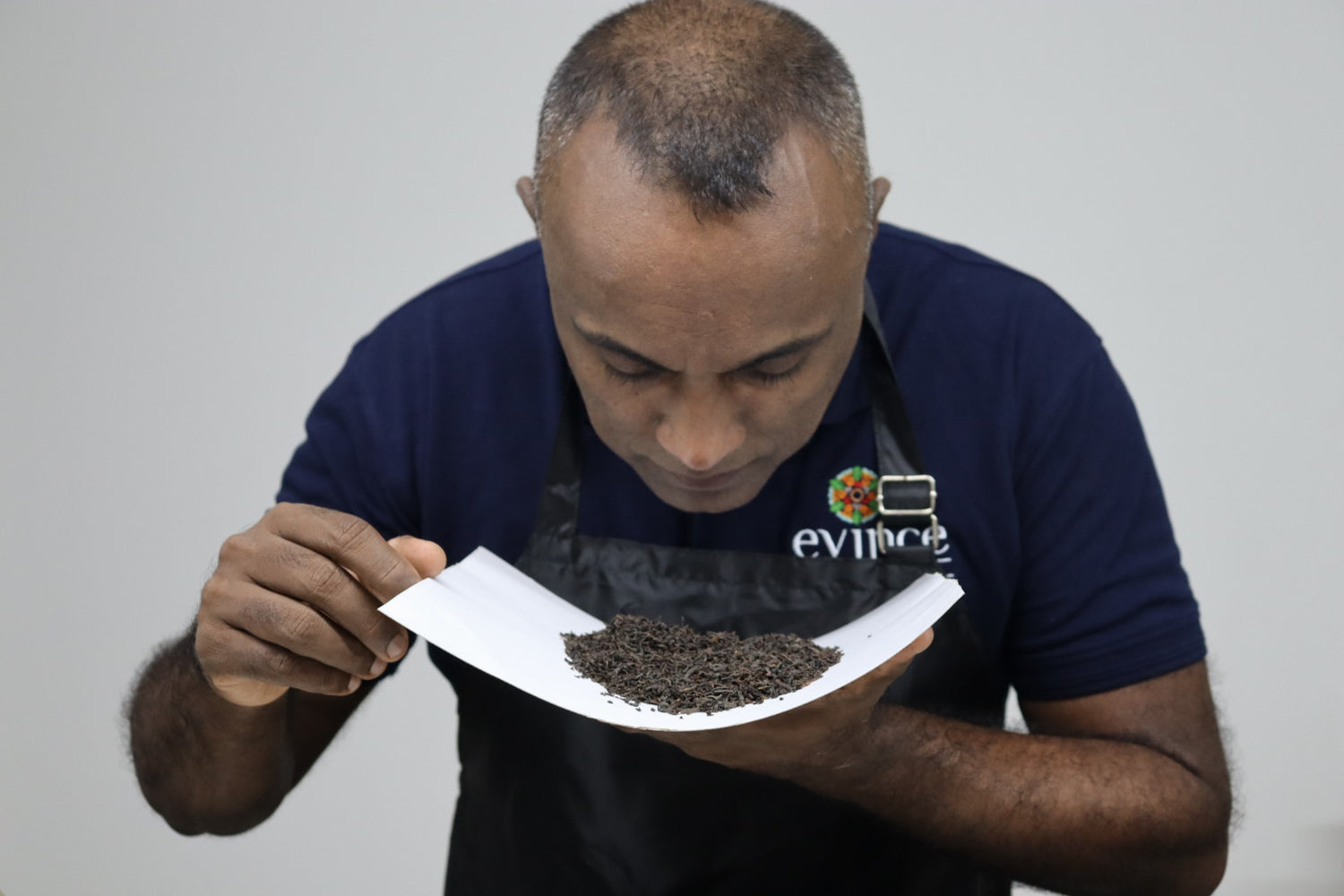 Evince ceylon tea founder checking a ceylon tea sample