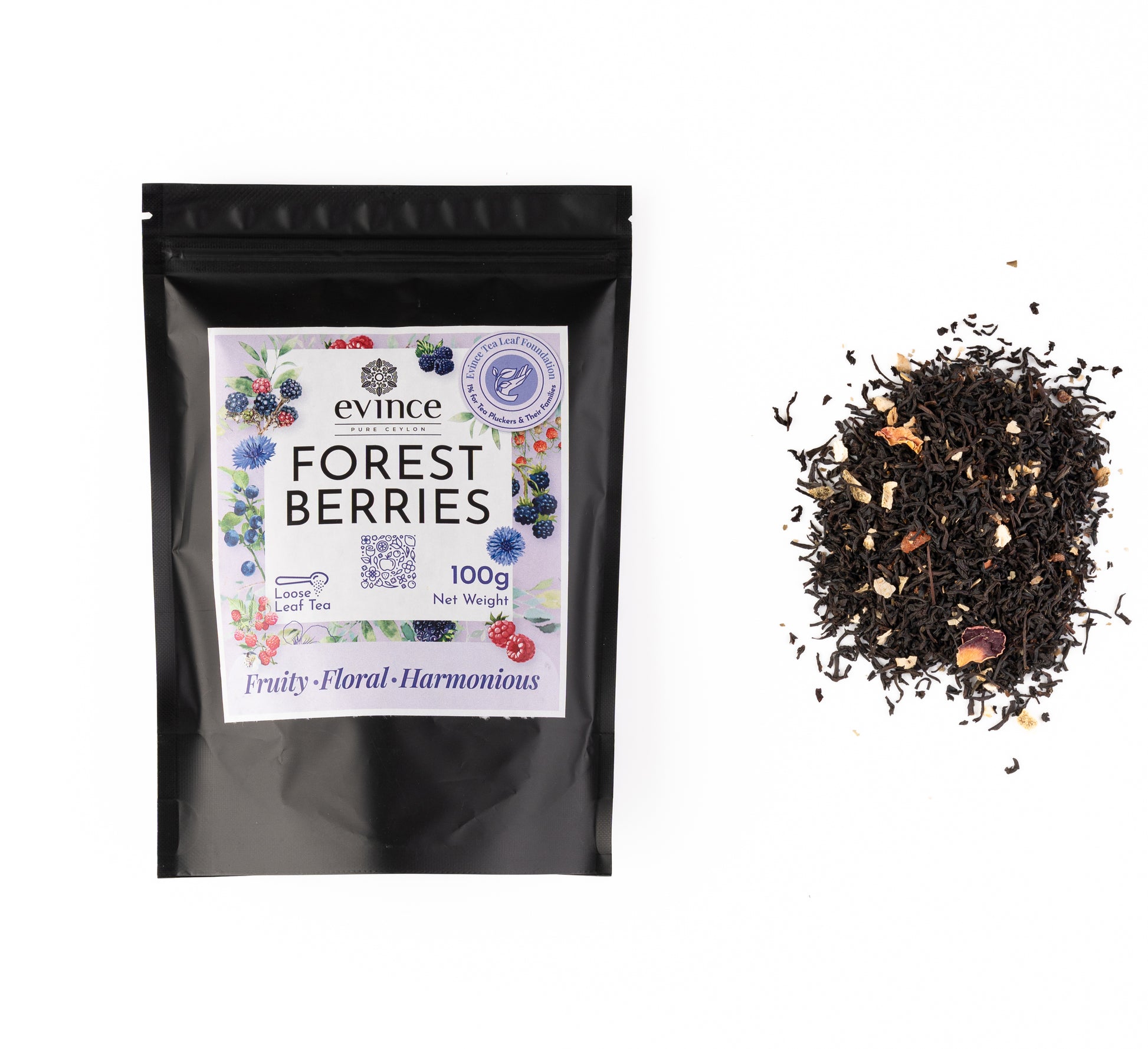 Vibrant berry-infused tea with hibiscus, elderberries, and rosehips with its pack on a white background