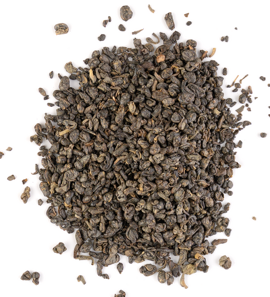 Rolled Ceylon Gunpowder green tea leaves on a white background