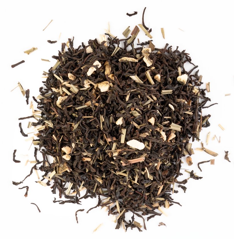 Zesty lemon-infused green tea with lemongrass and citrus peel on a white background