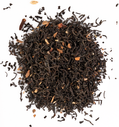 Aromatic Ceylon black tea with whole spices like cinnamon, cardamom, and cloves on a white background