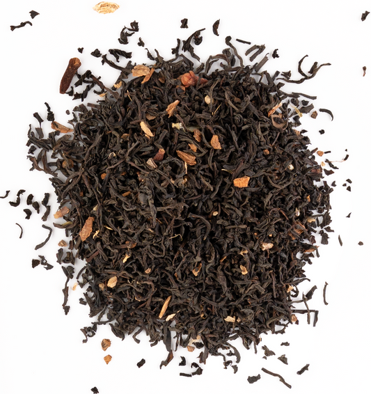 Aromatic Ceylon black tea with whole spices like cinnamon, cardamom, and cloves on a white background