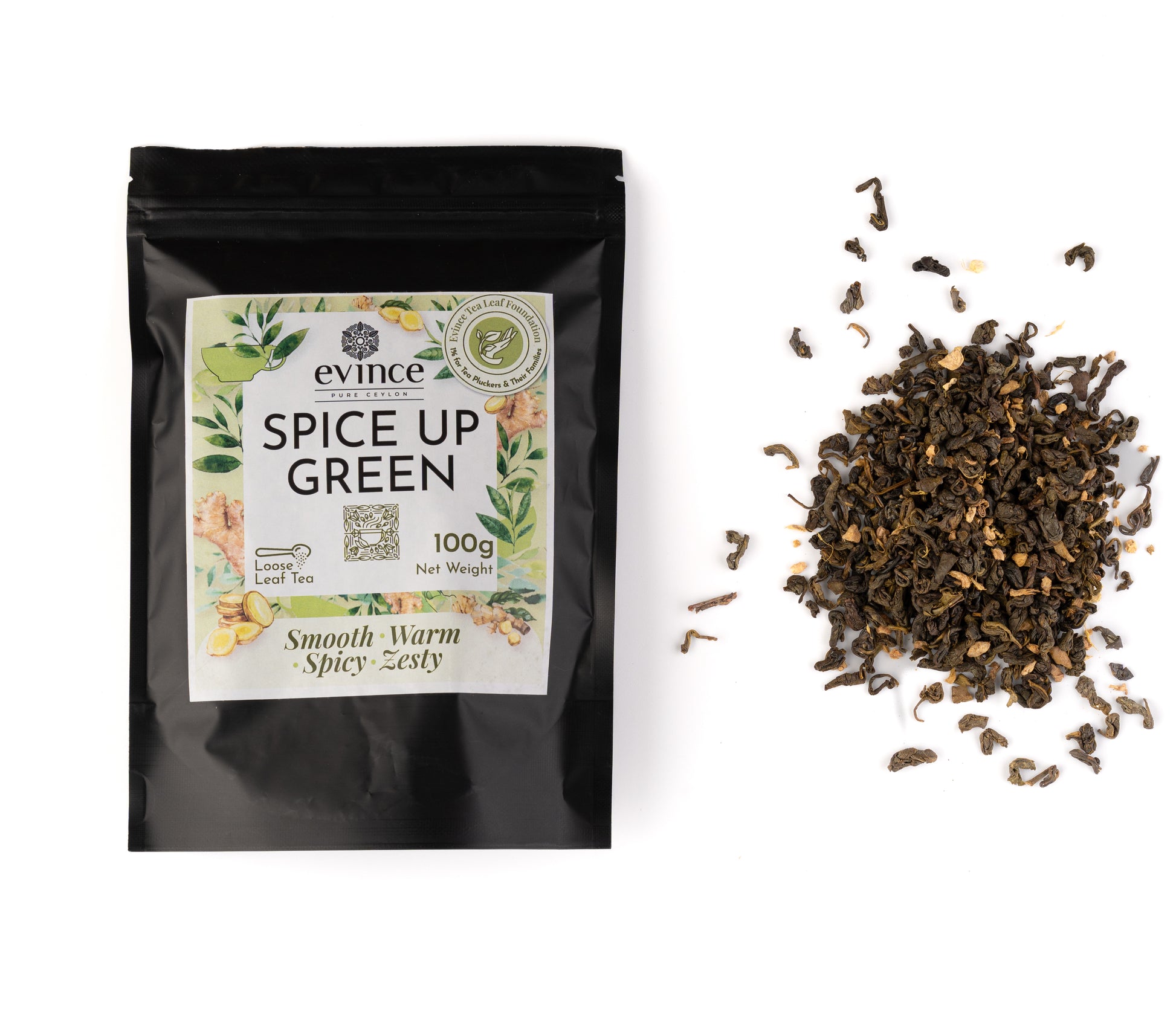 Loose leaf green tea with visible ginger and spice pieces and its pack on a white background