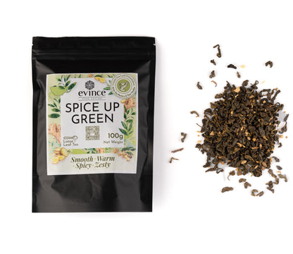 Loose leaf green tea with visible ginger and spice pieces and its pack on a white background