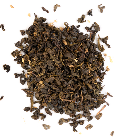 Ceylon green tea blend with dried peach and ginger on a white background.