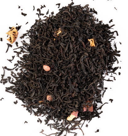 Bright red hibiscus tea with dried berries and petals on a white background