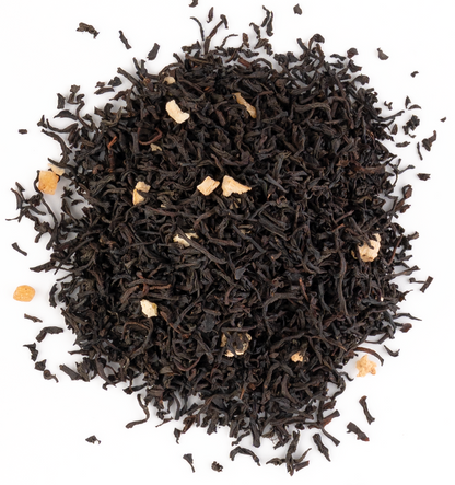 Bright black tea with pineapple, passion fruit, and lemon peel on a white background